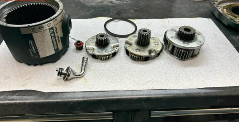 Boat winch being greased during marine equipment maintenance